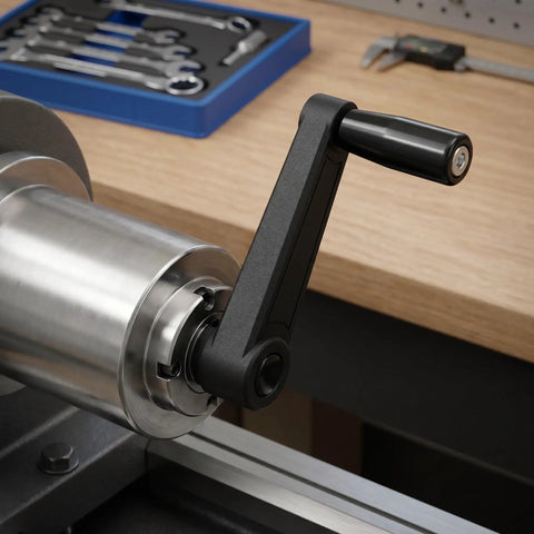 Essential 5-Inch Industrial Hand Crank Handle Set, ergonomic black nylon crank handle attached to a milling machine.