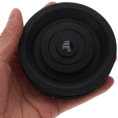 4 Pack Weight Lifting Pulley Wheels With Nylon Bearings And Cable Rollers For Gym Equipment Replacement Parts 22.5mm And 25mm Width For Home Gym And Commercial Machines Easy Install Durable, black pulley wheel in hand
