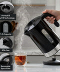 Rapid Fire 1500W Electric Kettle With 1.8 Liter Capacity BPA Free Build pouring hot water into a glass with tea.