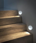 Motion Sensor Night Light With Auto On Off, No Fuss Cool White LED Path Light illuminating wooden stairs at night, battery powered