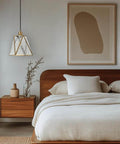 Copper Brass Pendant Light With Water Ripple Glass Lampshade, 10.2 Inch Geometric Pendant Lighting in modern bedroom setting.