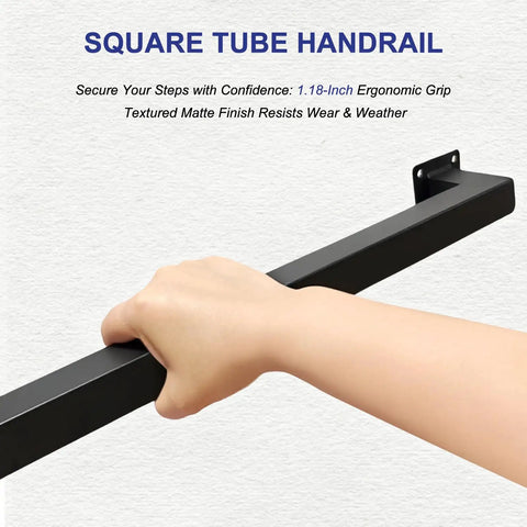Hand gripping a matte black square tube handrail from the Kickass 7 Ft Indoor Stair Railing with non-slip grip.