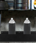 Wall Mount Spray Can Holder And Tool Rack Heavy Duty Metal Storage Shelf with two aerosol cans in garage setting