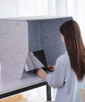 Person using a Portable Soundproof Booth With Acoustic Foam Panels for Hella Crisp Audio and Tight Room Acoustics.