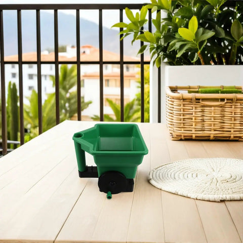 Green Handheld Seed Spreader And Planting Seeder For Veggies And Lawn Care Portable Hand Crank Broadcast Spreader Tool on table