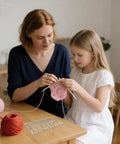 Woman and girl using Super Crisp Acrylic Gauge Ruler For Knitting And Crochet No Sweat Stitch Measurement Guide with yarn.
