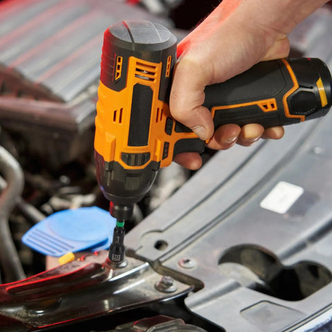 Person using electric drill with Beast 41-Piece Magnetic Nut Driver Set With Impact Bits For Quick Work on car engine