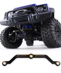 Close-up of Traxxas 1 18 Scale Brass Steering Link Upgrade for TRX4M TRX4MT RC Crawler under a blue RC car