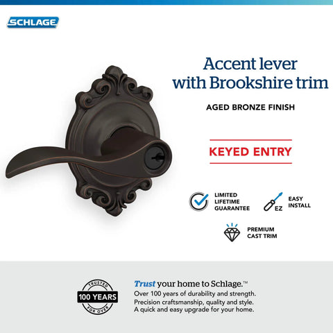 Accent Lever With Brookshire Trim Keyed Entry Lock In Aged Bronze, ornate design, displayed on light background.