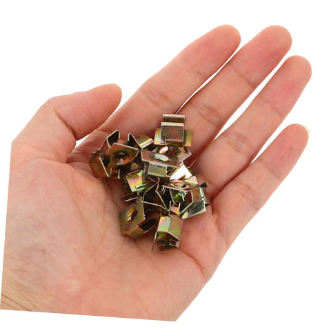Premium Gold U Shaped Automotive Fasteners 50 Piece Set Replacement Panel Mounting Clips for Cars and Trucks, hand holding clips.