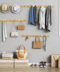 Natural Wood Wall Coat Rack Set Of 4 Wall Mount Hooks For Towels Hats Keys And Shoes And Vertical Coat Hanger displayed in living room