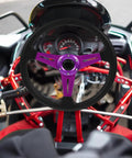 Detachable Racing Steering Wheel For Golf Cart ATV Kart Beach Buggy Purple Aluminum Alloy Quick DIY Install Multivehicle Compatibility Sports Steering Wheel For Vehicle Simulation And Outdoor Fun installed in a kart.