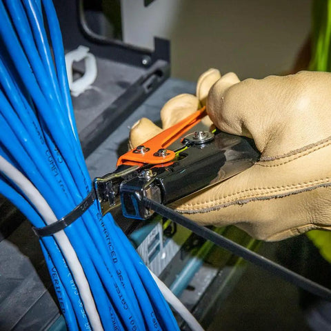 Pro Grade Heavy Duty Cable Tie Tensioning Tool For 120 To 250 Pound Ties Delivers Up To 65 Pound Tension Supports Fifteen Thirty Second Inch Wide Ties Grippy Handle For Easy Secure Fastening On The Job in use on cable bundle