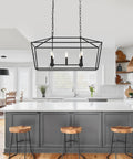 Farmhouse Five Light Candle Pendant Chandelier In Matte Black For Dining Room Foyer Or Porch hanging over kitchen island