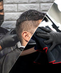 Schneider black nitrile exam gloves, latex-free and powder-free; two people wearing large disposable gloves.
