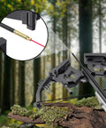 Red Laser Crossbow Bore Sight With Batteries, Easy Thread-On Red Dot Boresighter on a black crossbow in a forest setting