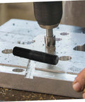 Manual Hole Knockout Puncher Tool Kit with Hydraulic Punch Driver in use on metal sheet