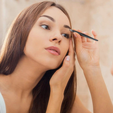 Woman using Two Pack Slant And Point Tip Tweezers Set For Eyebrows And Ingrown Hair Removal, stainless steel, close-up view.