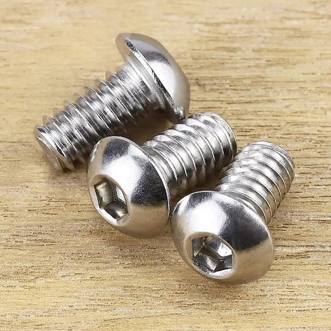 Fifty Pack Button Head Socket Cap Screws Sized For 10-32 Thread By Half Inch Finely Threaded Eighteen Eight Stainless Steel Hardware close-up on wooden surface.