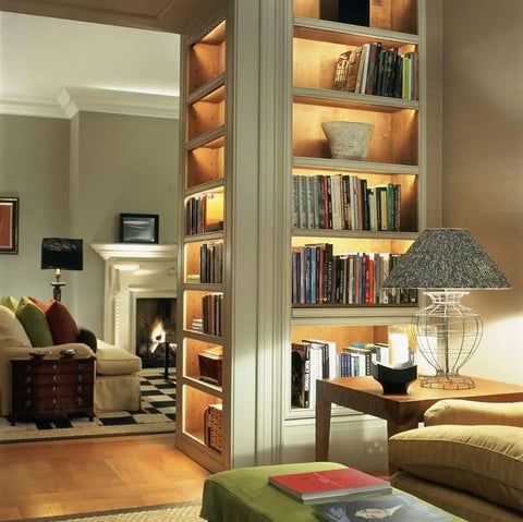 Under Cabinet Lighting Bar For Kitchens And Bookshelves, Ultra Slim LED Light, illuminating bookshelves in cozy living room.