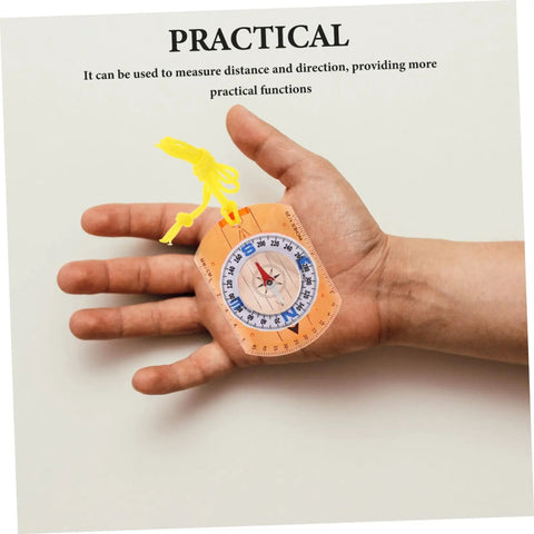 Person holding Orienteering Compass Pointer Lightweight Hiking Navigation Tool For Outdoor Adventures Go To Camping And Travel Gear With Luminous Coating in hand