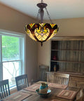 Dining room with Tiffany Style 18 Inch Stained Glass Pendant Lights With Three Lights Victorian Antique Hanging Lamp, cozy glow.
