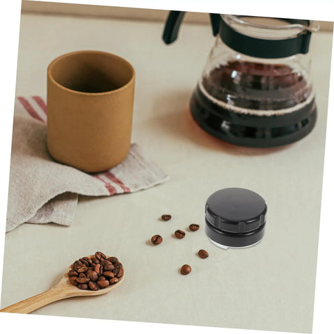 Pro Grade Reusable Metal Tamper Set For Espresso Machines next to coffee beans and cup on table
