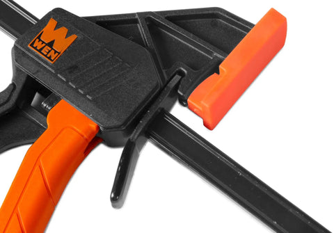 Close-up of Beefy 24 Inch Steel Bar Clamps And Spreaders Two Pack with orange ergonomic trigger.
