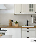 Oil Rubbed Bronze Cabinet Cup Pulls Three And A Half Inch Overall Length 10 Pack Durable Drawer Handles visible on white kitchen cabinets.