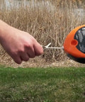 Person using Pro Grade Chalk Line Reel With 110 Foot Reach, 12 Ounce Chalk Capacity, Extra String, outdoor setting