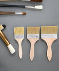 Three Piece Paint Brush Set For Deck, Fence, Wall Stain, Durable Wood Handle Workhorse Brushes on gray surface
