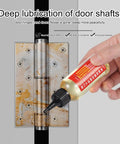 Applying Door Hinge Lubricant Penetrating Oil For No More Squeaks And Rust Prevention to rusty door hinge.