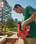 Slick Two In One Cordless 18 Gauge Brad Nailer And Crown Stapler For Diy Home Projects in use on wood outdoors