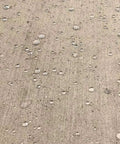 Water droplets on concrete surface showing effect of Odorless Concrete And Masonry Waterproofer Spray On For 1 Gallon Ready To Use