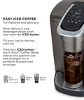 Kick Up Your Morning Routine With This Dope Single Serve Coffee Maker Featuring K Cup Compatibility Strong Brew And Iced Settings Programmable Temp Control Plus Multiple Cup Sizes In Solid Brushed Slate with iced coffee in glass.