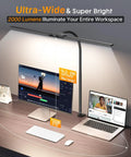 Workspace illuminated by 3 In 1 LED Floor Lamp Desk Clamp On With Remote Control, featuring adjustable gooseneck next to computer screens.
