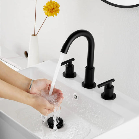 Woman washing hands under Black Bathroom Faucet With Two Handles Widespread 3 Holes Deck Mount No Fuss Install 360 Degree Swivel Spout