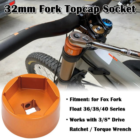 Orange 32mm 3/8 Drive Fork Topcap Socket For Fox 36 38 40 Series Mountain Bike Forks next to bike handlebar and fork