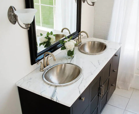 Edison Dual Mount Oval Bathroom Sink in Hammered Nickel Finish on modern double vanity with mirror and marble countertop