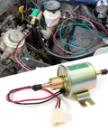 12V Electric Fuel Pump Kit Universal For Carburetor Engines With 6.56 Feet 5/16 Inch ID Fuel Line Filters And 10 Hose Clamps 2.5 To 4 PSI Output installed in vehicle engine bay