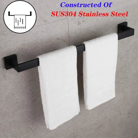 24 Inch Contemporary Stainless Steel Towel Bar Wall Mount With Slick Matte Black Finish holding white towels