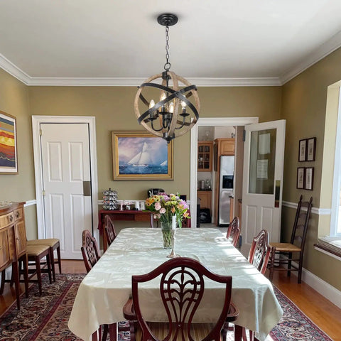 Cozy Rustic Farmhouse 4 Light Chandelier With Height Adjustable Design in a dining room, wood frame, vintage white finish.