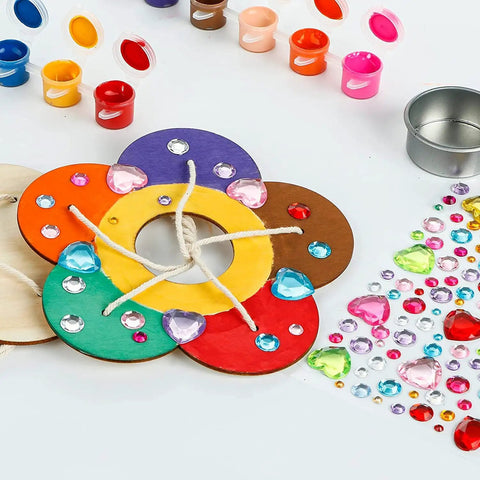 Close-up of Two Pack Diy Wooden Bird Feeder Craft Kits For Kids Outdoor Fun, with paints and rhinestones for decoration.