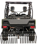Back view of Heavy Duty ATV UTV Landscape Rake For Rock Debris Removal, attached to ATV with visible tines.