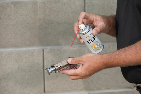 CLP Gun Cleaner Lubricant Preservative Spray With Synthetic Oil, 4 oz Aerosol being used on firearm part