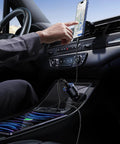 Person using 130W USB C Car Charger For iPhone And Galaxy in car, charging phone. Multi Device Type C Car Adapter with Safe Smart Charging.