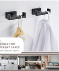 Matte Black Stainless Steel Double Towel Hooks For Wall Mount, SUS304 Robe Coat Hangers in bathroom, holding towel and brush.