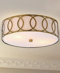 Lit 12.25-Inch Brass Gold 2-Light Sleek Modern Metal LED Flush Mount Ceiling Light With White Linen Drum Shade And Geometric Fretwork