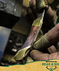 Close-up of Compact 2.25 Inch Folding Pocket Knife With 440 Stainless Clip Point Blade Rosewood Handle being polished by hand.