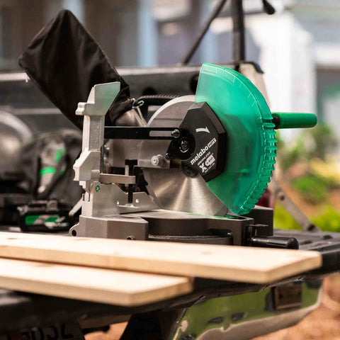 Cordless Miter Saw Kit With 10-Inch Blade, 18V and 36V MultiVolt Battery, shown with extendable rip fence on site table